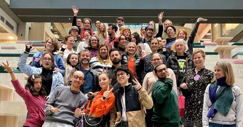 Group of people on stairs posing happy